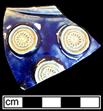 Gray-bodied salt glaze stoneware mug or jug with applied floral prunts outlined in cobalt-blue under the glaze from 18CV60.